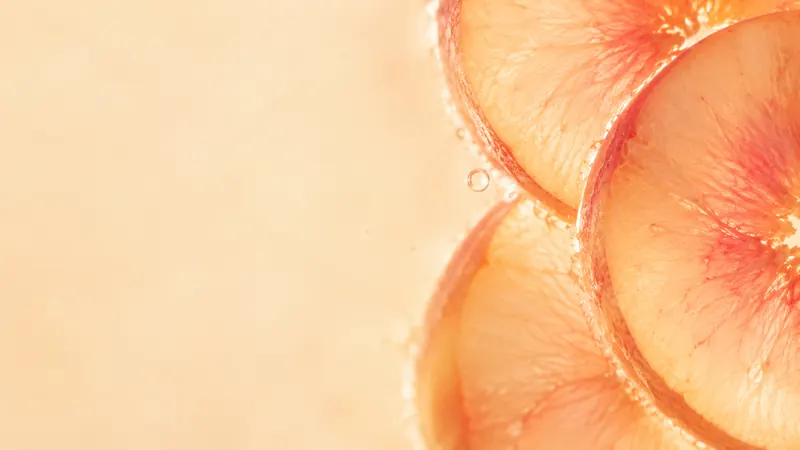 Thin white-peach slices glowing in warm light.